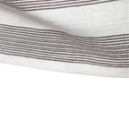 Close-up of a white fabric with thin black stripes on a white background