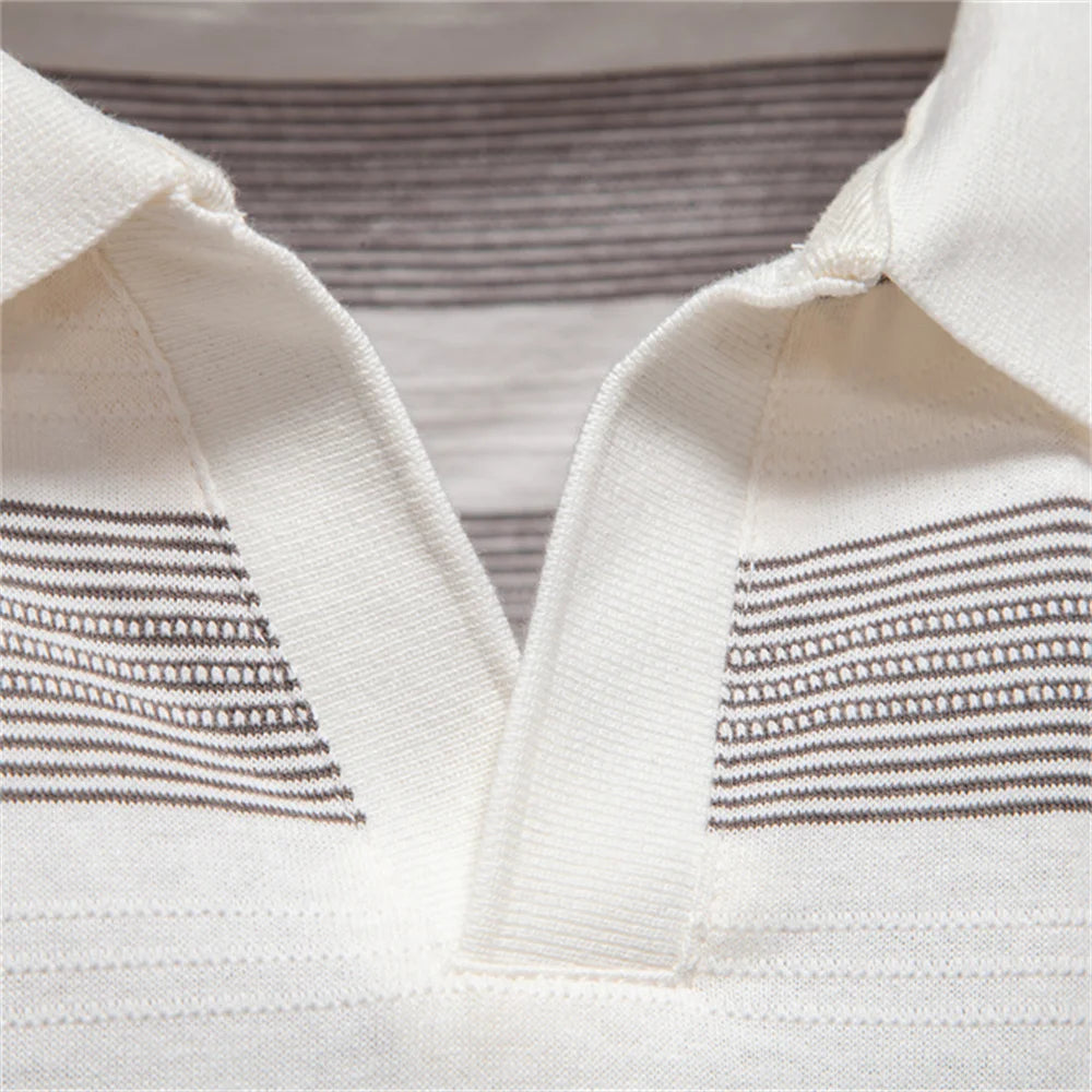Close-up of a white garment with brown striped patterns on a neutral background
