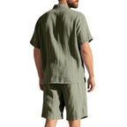 Man wearing a green striped shirt and shorts set on a white background