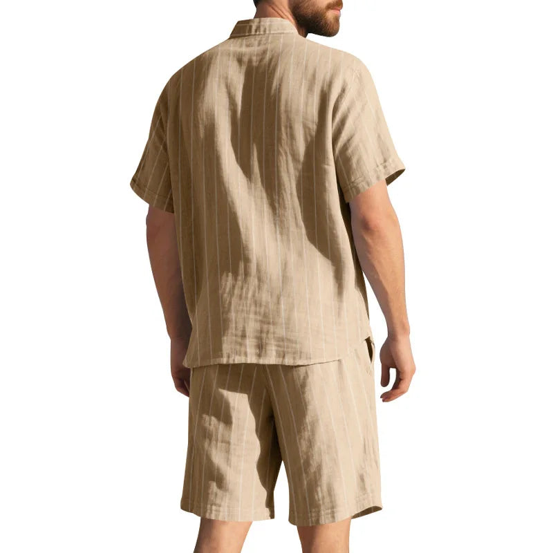 Man wearing a beige shirt and shorts set on a white background