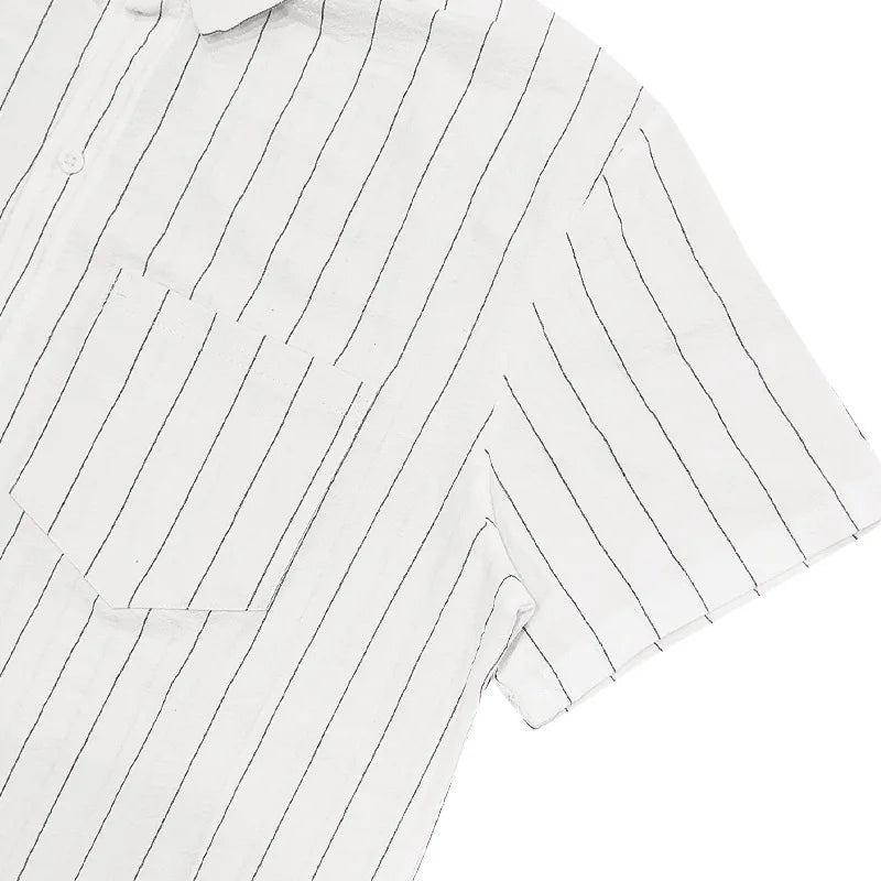 Close-up of a white shirt with thin black vertical stripes on a white background