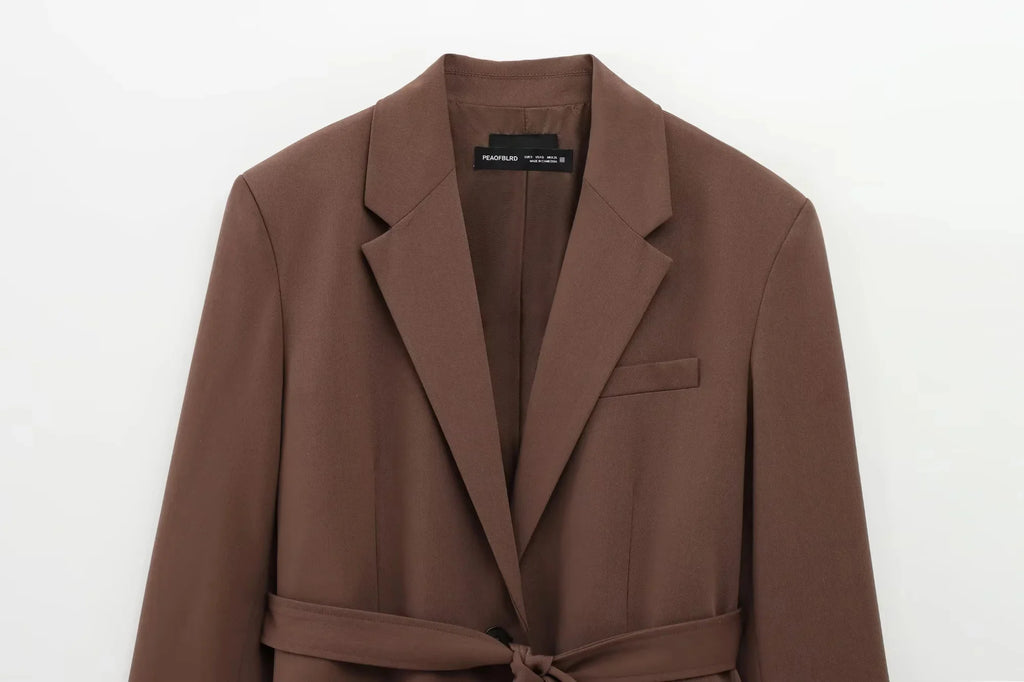 Brown coat with a belt on a white background