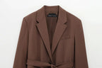 Brown coat with a belt on a white background