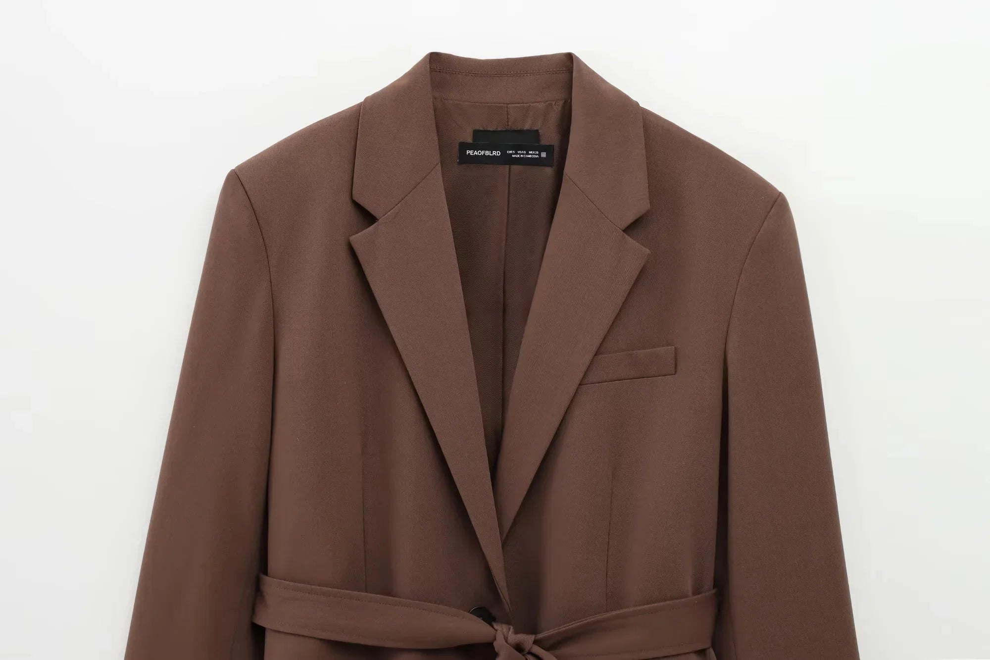 Brown coat with a belt on a white background