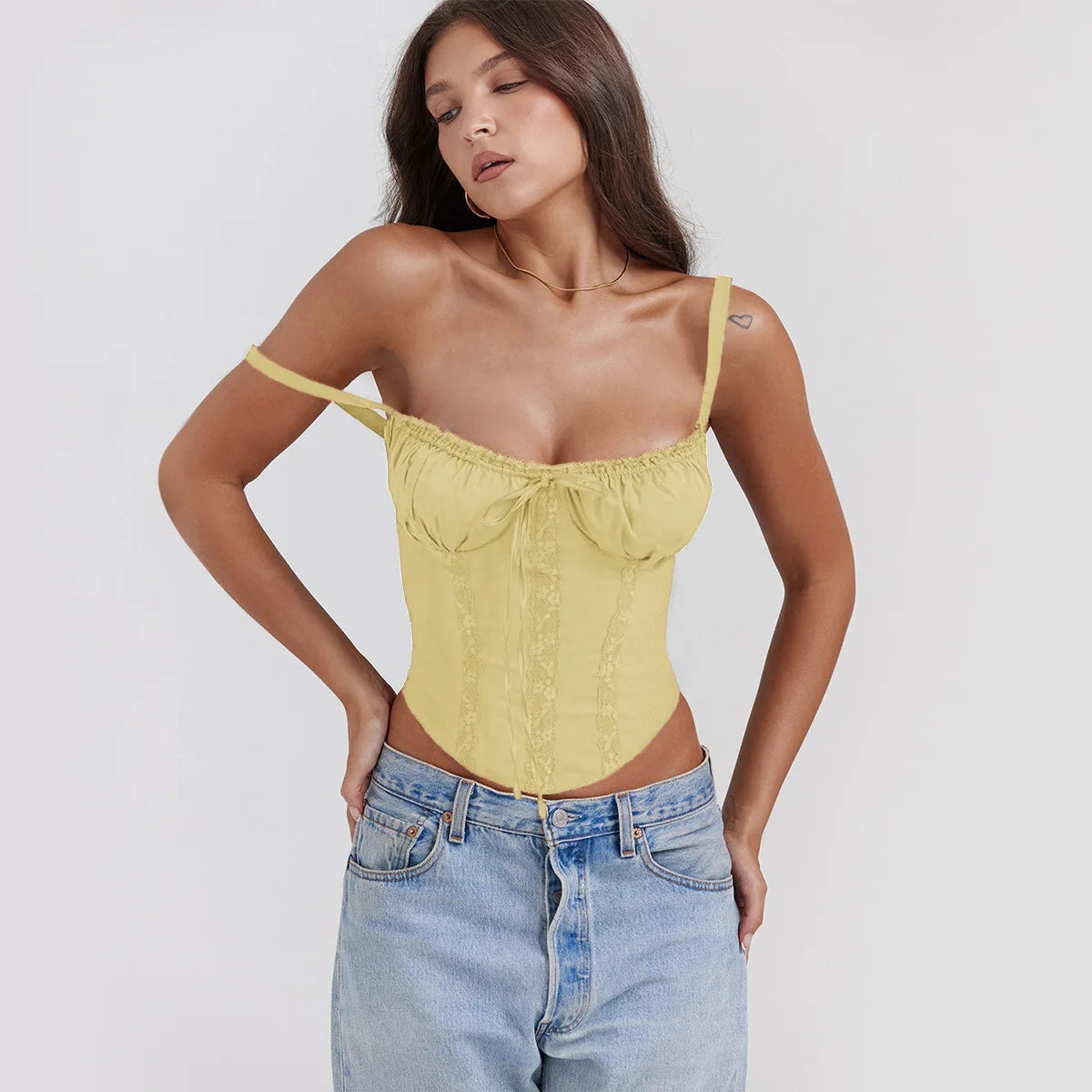 The structured bodice and curved hem of the Altivieri Florence white corset top.